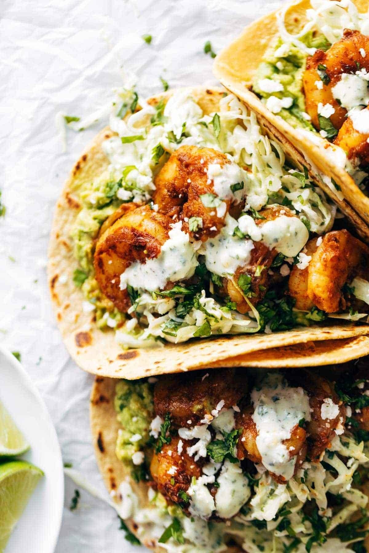 Shrimp tacos with slaw on top.