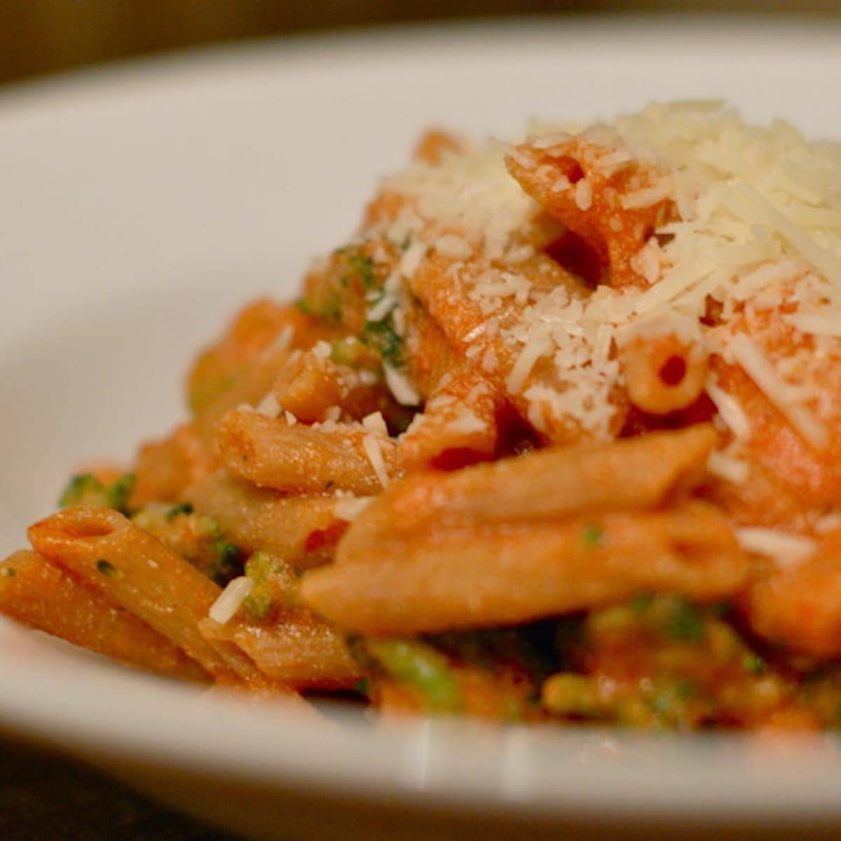 Tomato Ricotta Pasta with Broccoli and cheese shreds.